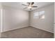 Bedroom featuring neutral walls, carpet flooring, ceiling fan with light, and window at 658 S Sycamore St # Value, Mesa, AZ 85202