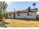 An exterior view of the house showing the side facade and landscaping at 658 S Sycamore St # Value, Mesa, AZ 85202