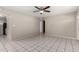 Living room featuring white tile flooring, neutral walls, and a modern ceiling fan at 658 S Sycamore St # Value, Mesa, AZ 85202