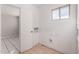 Utility room with tile flooring, a window and washer and dryer hookups at 658 S Sycamore St # Value, Mesa, AZ 85202