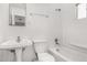 Bright bathroom showing single sink, toilet, and shower-tub combo at 7022 N 26Th Dr, Phoenix, AZ 85051