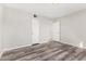 This bedroom features modern gray floors and white walls for a clean, contemporary look at 7022 N 26Th Dr, Phoenix, AZ 85051