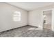 Bedroom with gray tiled floors and window offers view to the exterior at 7022 N 26Th Dr, Phoenix, AZ 85051