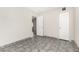 Bedroom featuring tiled floor, closet, and door to hallway at 7022 N 26Th Dr, Phoenix, AZ 85051