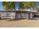 Charming single story home with desert landscaping and mature trees in the front yard at 7022 N 26Th Dr, Phoenix, AZ 85051