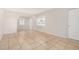 Bright living room showcasing tiled flooring and fresh neutral paint at 7022 N 26Th Dr, Phoenix, AZ 85051