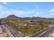 Stunning aerial view of the community, showcasing landscaping, mountain views, and city access at 7151 E Rancho Vista Dr # 2007, Scottsdale, AZ 85251