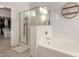 Spa-like bathroom featuring separate tub and shower, plus walk-in closet access at 7611 S 15Th St, Phoenix, AZ 85042