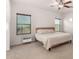 Relaxing bedroom featuring plush carpet, a ceiling fan, and serene natural light at 7611 S 15Th St, Phoenix, AZ 85042