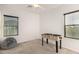 Bedroom featuring a foosball table, a gray beanbag chair, and wood-look flooring at 7611 S 15Th St, Phoenix, AZ 85042