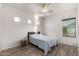 Bright bedroom with light wood-look floors, recessed lighting, and a ceiling fan at 7611 S 15Th St, Phoenix, AZ 85042