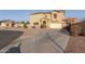 View of two-story home featuring desert landscaping, neutral color scheme, and solar panels at 7611 S 15Th St, Phoenix, AZ 85042