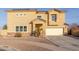 Two-story home featuring a two car garage, neutral color scheme, and desert landscaping at 7611 S 15Th St, Phoenix, AZ 85042