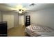 The bedroom offers carpet flooring, a ceiling fan, and a standard closet at 765 S Ruby Pl, Gilbert, AZ 85296