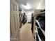 Walk-in closet featuring shelving and plenty of storage space at 765 S Ruby Pl, Gilbert, AZ 85296