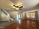 Inviting living room with hardwood floors, staircase, and plenty of natural light at 765 S Ruby Pl, Gilbert, AZ 85296