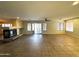 Expansive living room featuring a fireplace and sliding glass door to the pool at 765 S Ruby Pl, Gilbert, AZ 85296