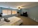 This is a spacious main bedroom with wood blinds, a ceiling fan, and carpet flooring at 765 S Ruby Pl, Gilbert, AZ 85296