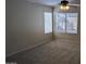 Bright bedroom with large windows, neutral carpeting, and a ceiling fan at 8014 W Beaubien Dr, Peoria, AZ 85382