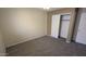 Neutral bedroom with ceiling fan, carpet, and closet offers a calming and private space at 8014 W Beaubien Dr, Peoria, AZ 85382