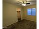 Bedroom featuring neutral paint, carpet, ceiling fan, and window offering natural light at 8014 W Beaubien Dr, Peoria, AZ 85382