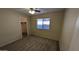 Well-lit bedroom with a ceiling fan, carpet flooring, and closet provides comfort and convenience at 8014 W Beaubien Dr, Peoria, AZ 85382