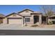 Charming single-story home featuring a well-maintained front yard and attached two-car garage at 8014 W Beaubien Dr, Peoria, AZ 85382