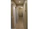 Hallway with tiled floor leads to the laundry room at 8014 W Beaubien Dr, Peoria, AZ 85382