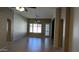 Bright living room with a ceiling fan and tile flooring at 8014 W Beaubien Dr, Peoria, AZ 85382