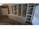 Office space featuring a large built-in bookshelf and cabinets at 8014 W Beaubien Dr, Peoria, AZ 85382