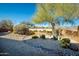 Desert backyard landscaping with gravel, cacti, and a decorative dry creek bed at 8502 E Cave Creek Rd # 10, Carefree, AZ 85377