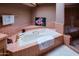 Bathroom featuring a soaking tub, walk-in shower, and lovely natural light at 8502 E Cave Creek Rd # 10, Carefree, AZ 85377