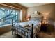 Cozy bedroom featuring large windows, plush carpet, and a comfortable bed at 8502 E Cave Creek Rd # 10, Carefree, AZ 85377