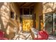 Inviting home entry with natural light and outdoor chairs at 8502 E Cave Creek Rd # 10, Carefree, AZ 85377