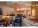 Open-concept living room showcasing natural wood accents, tile flooring, and seamless transitions to the dining area at 8502 E Cave Creek Rd # 10, Carefree, AZ 85377