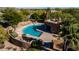 Aerial view of the large outdoor pool and patio area, surrounded by desert landscaping at 8502 E Cave Creek Rd # 10, Carefree, AZ 85377