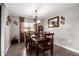 Formal dining room featuring a table for six and decorative chandelier lighting at 902 W Desert Valley Dr, San Tan Valley, AZ 85143