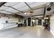 Well-organized garage with epoxy flooring, overhead storage, and a ladder, optimizing space and functionality at 902 W Desert Valley Dr, San Tan Valley, AZ 85143