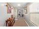 Hallway with hardwood floors, neutral paint, and decorative accents, leading into the home at 902 W Desert Valley Dr, San Tan Valley, AZ 85143