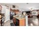 Open concept kitchen with granite countertops and stainless steel appliances at 902 W Desert Valley Dr, San Tan Valley, AZ 85143