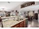 Open concept kitchen featuring granite countertops and stainless steel dishwasher at 902 W Desert Valley Dr, San Tan Valley, AZ 85143