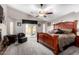 Spacious primary bedroom featuring a ceiling fan and a sliding door to the backyard at 902 W Desert Valley Dr, San Tan Valley, AZ 85143