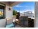 Outdoor grilling area with stainless steel grill, stone accents, and a view of the sky and neighborhood at 902 W Desert Valley Dr, San Tan Valley, AZ 85143