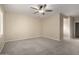 Spacious bedroom has a ceiling fan and carpet flooring at 9035 W Quail Track Dr, Peoria, AZ 85383