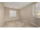 Neutral bedroom with a large window and tile flooring at 9035 W Quail Track Dr, Peoria, AZ 85383