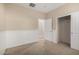 Bedroom with carpet, wainscoting and a closet at 9035 W Quail Track Dr, Peoria, AZ 85383