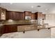 Spacious kitchen island with seating, granite countertops, and stainless steel appliances at 9035 W Quail Track Dr, Peoria, AZ 85383