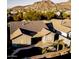 Lovely single-story home featuring a tile roof, desert landscaping, and refreshing private pool at 9035 W Quail Track Dr, Peoria, AZ 85383