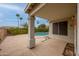 Covered patio overlooking a private pool and lush landscaping, creating a serene and relaxing outdoor living space at 9213 W Clara Ln, Peoria, AZ 85382