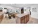 Bright kitchen highlighting an island with counter seating and open layout to living spaces at 9213 W Clara Ln, Peoria, AZ 85382